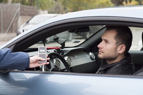 Officer giving breathalyzer test